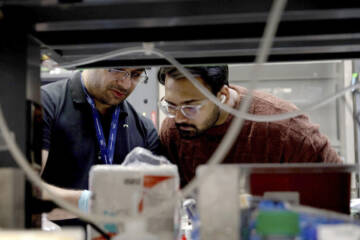 Two researchers in a lab setting